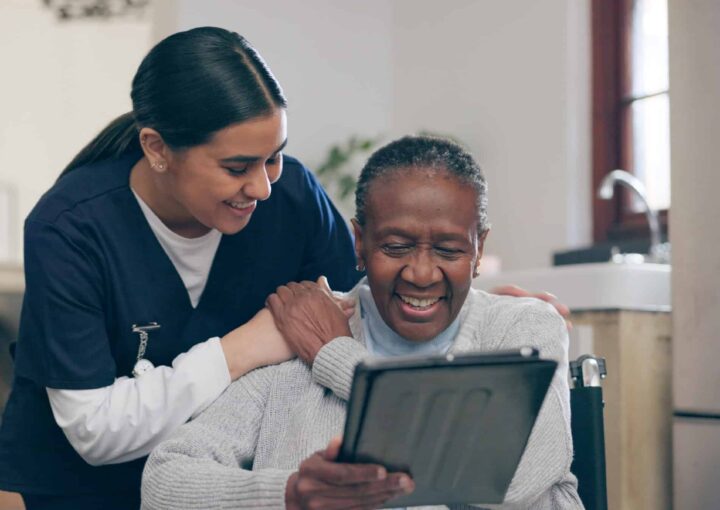 tablet-discussion-nurse-with-patient-research-medical-diagnosis-nursing-home-consultation-digital-technology-female-caregiver-talk-senior-black-woman-rehabilitation-clinic-scaled